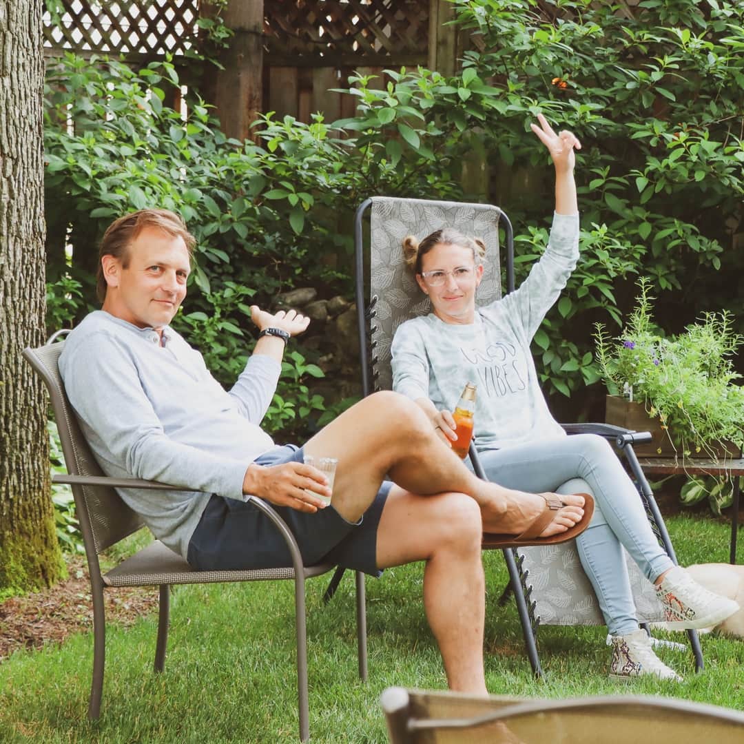 Coworkers waving at a company bbq