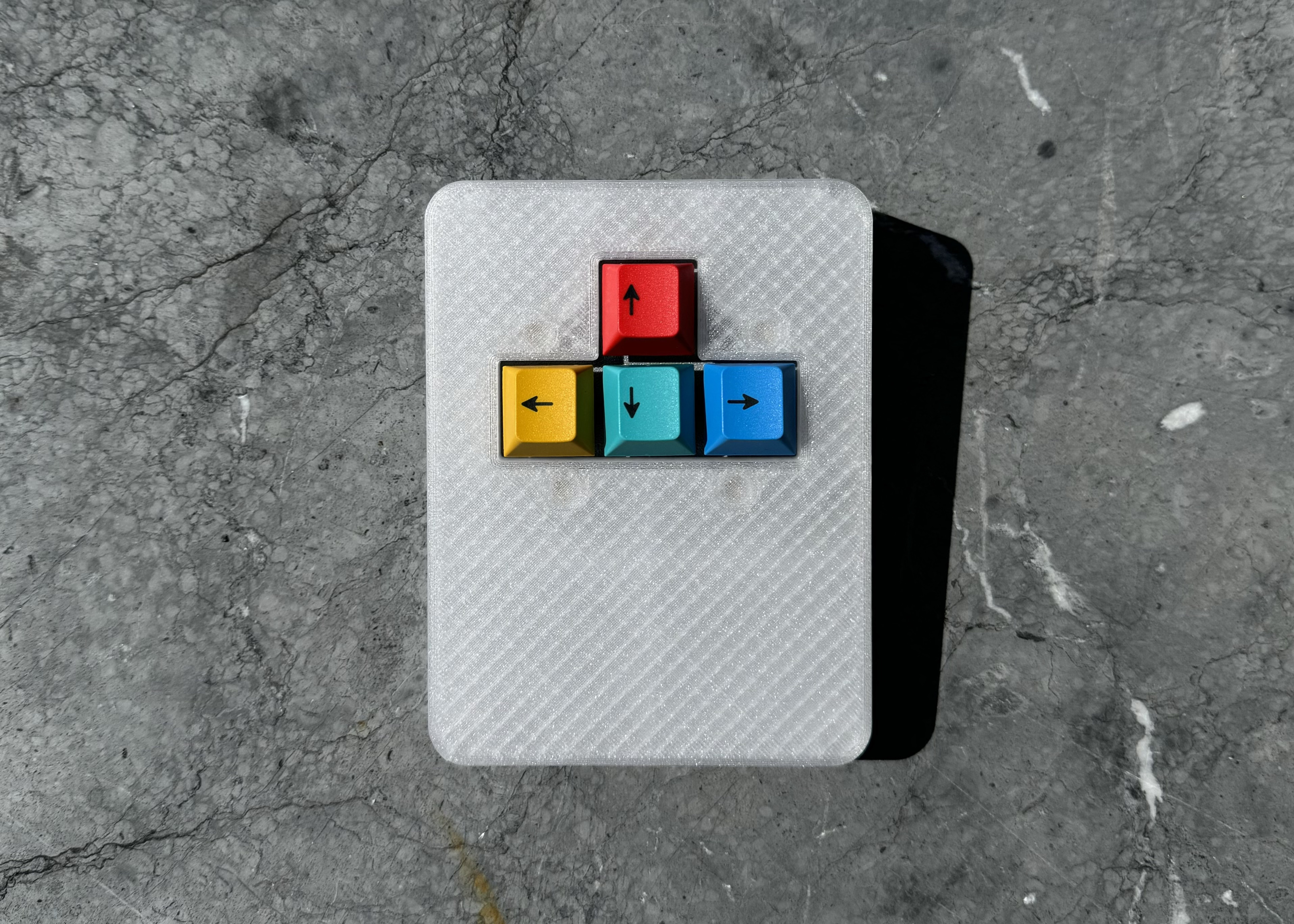 Top down view of custom 3D printed macropad with Dual Shot arrow cluster keys