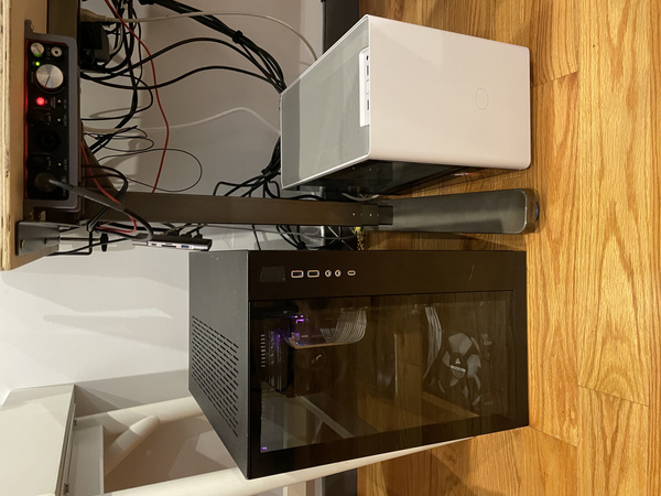 Lian Li O11D next to Cooler Master NR200P