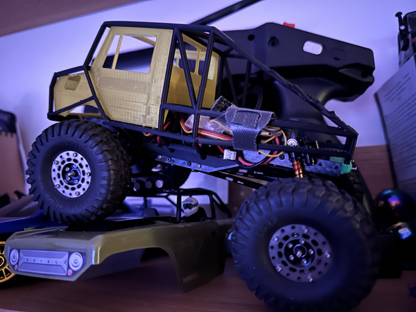 Custom 3D printed carbon nylon roll cage for a 1/24 Unimog RC 