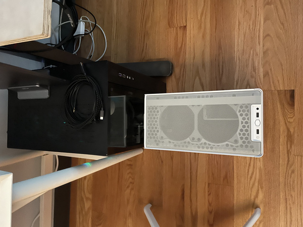 Top down size comparison view of Cooler Master NR200P in front of a Lian Li O11D