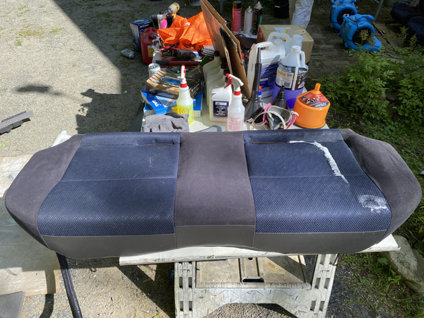 Steam cleaning the rear bench seat from a 2003 Subaru WRX wagon