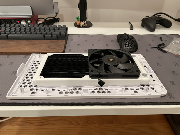XSPC thin 240 radiator mod attached to Cooler Master NR200P top panel
