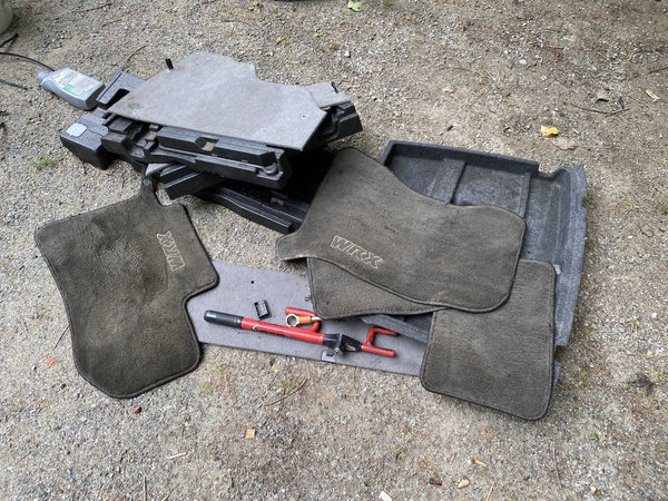 A pile of interior bits from a 2003 Subaru WRX wagon