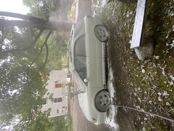 Using a foam canon on a white 2003 Subaru WRX Wagon