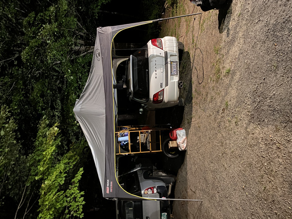 White 2003 Subaru WRX Wagon under a tent 