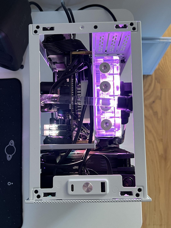 Top down view of custom water loop in Ssupd Meshlicious case with purple lighting