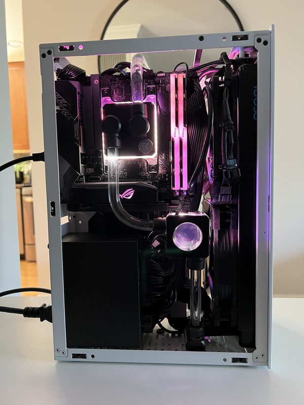 CPU side of custom water loop in Ssupd Meshlicious case with purple lighting