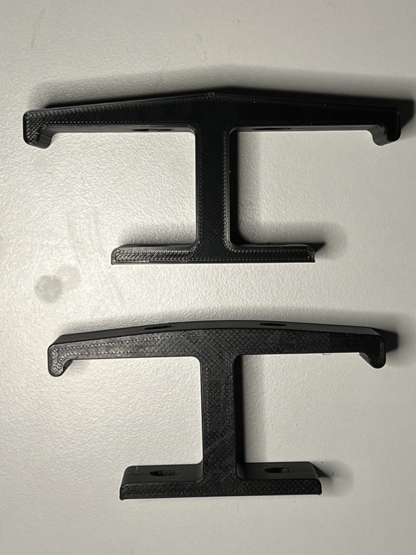 Size comparison of 2 3D printed headphone hooks