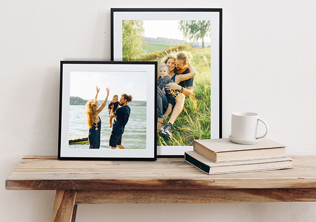 two framed prints of a cute family outside