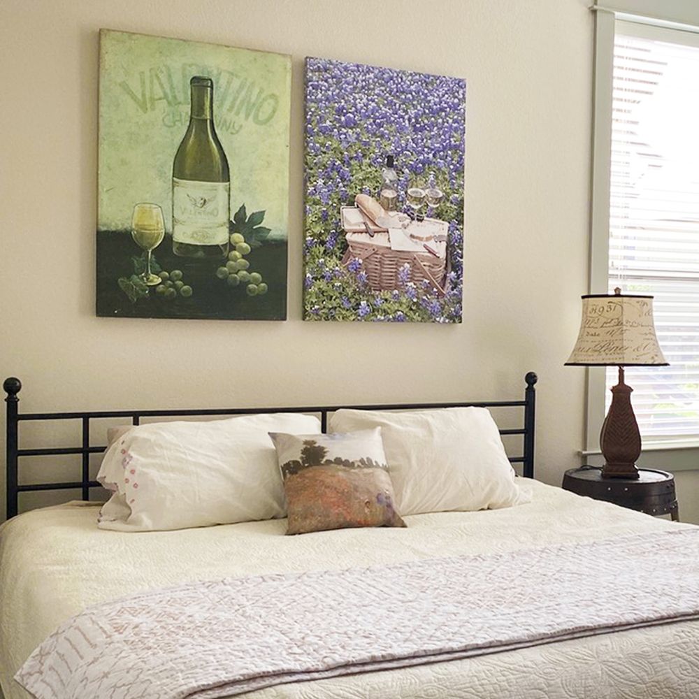 canvas prints hung above a bed