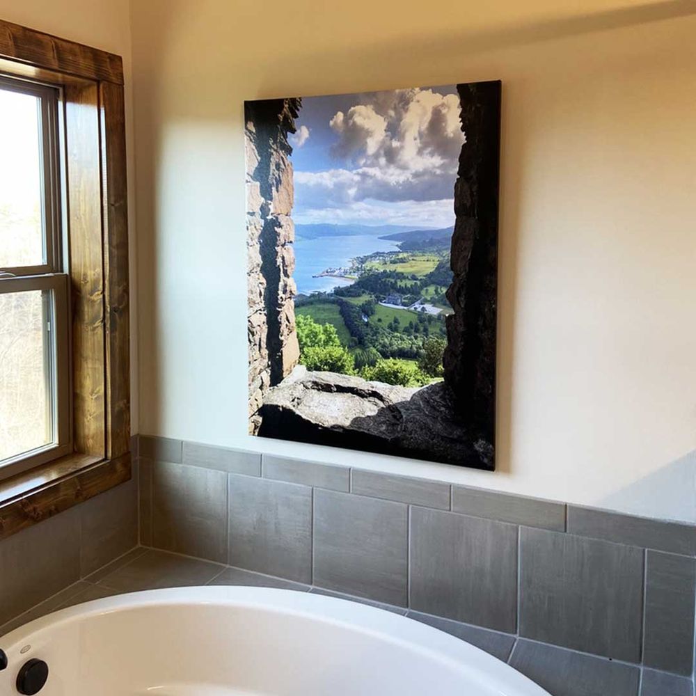 A canvas print on a bathroom wall