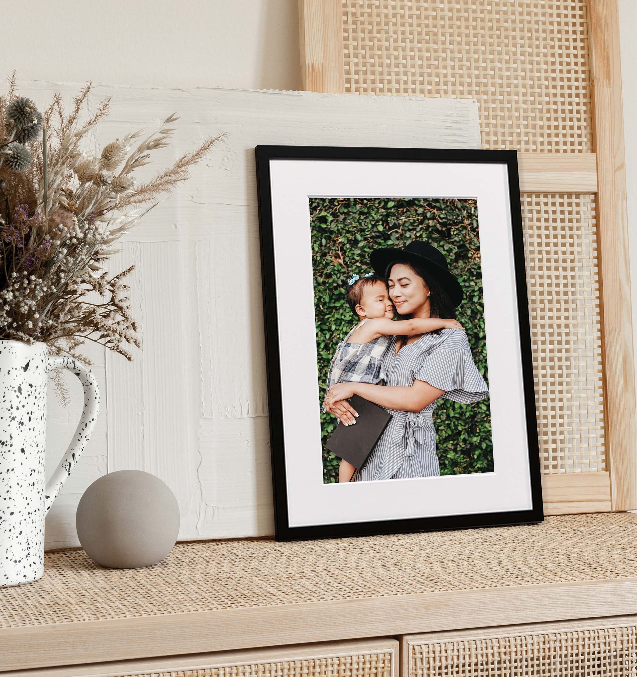 framed print of a mother and child hugging
