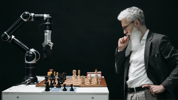 Man with a white beard play chess vs Robot