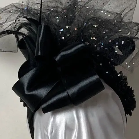 Black bow with wispy sparkle