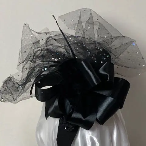 Black bow with wispy sparkle