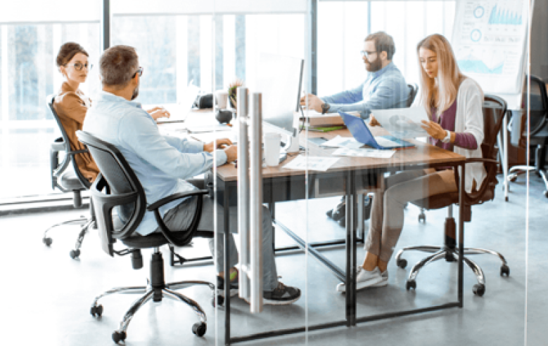 Business meeting in a contemporary office with a diverse team engaging in discussion, highlighting inclusive corporate communication and strategy.