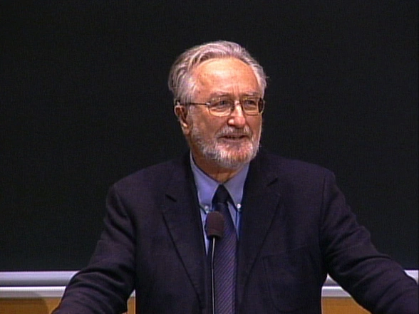John Dower lecturing in a classroom, standing in front of a chalkboard