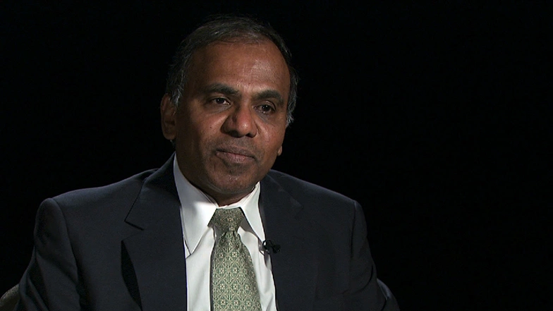 Subra Suresh seated in front of a black background for an on camera interview.