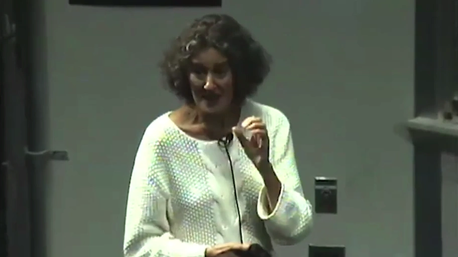 Barbara Liskov speaks into microphone at podium