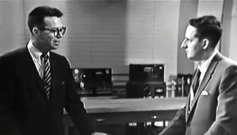 TV host John Fitch in conversation in 1960s science television program.