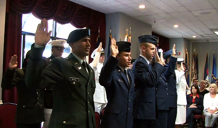 A group of graduating ROTC candidates take the Oath of Office.