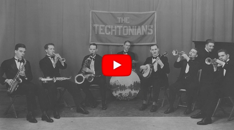 Black & white photo of group of people playing jazz instruments