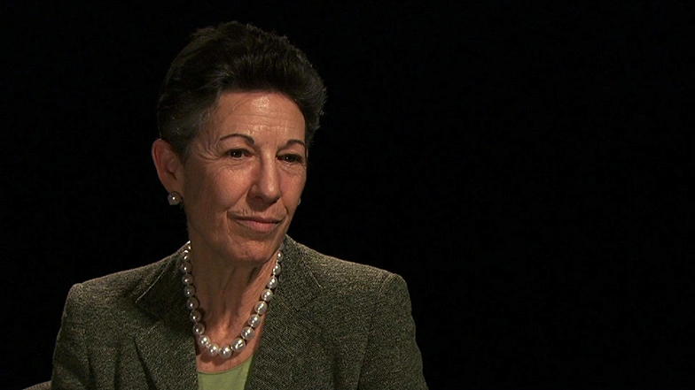Barrie Zesigerseated in front of a black background for an on camera interview.