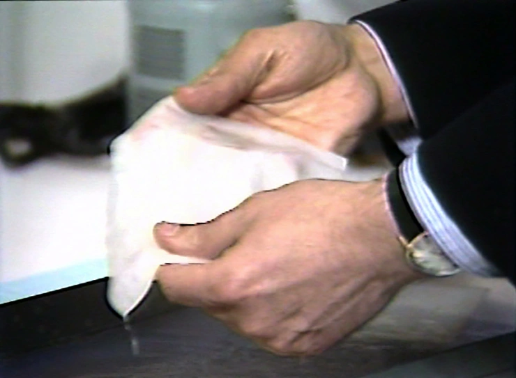 Artificial skin is held up for inspection