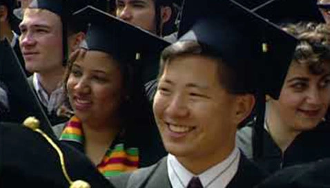 Students in gowns awaiting the start of Commencement ceremonies.