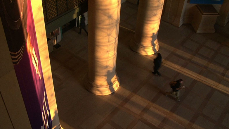 The mid-November setting sun casting light on the lobby of MIT's Building 7 evoking the appearance of Stonehenge