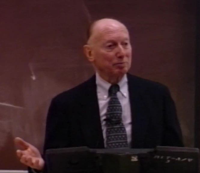 Peter Glaser speaking at podium on a stage