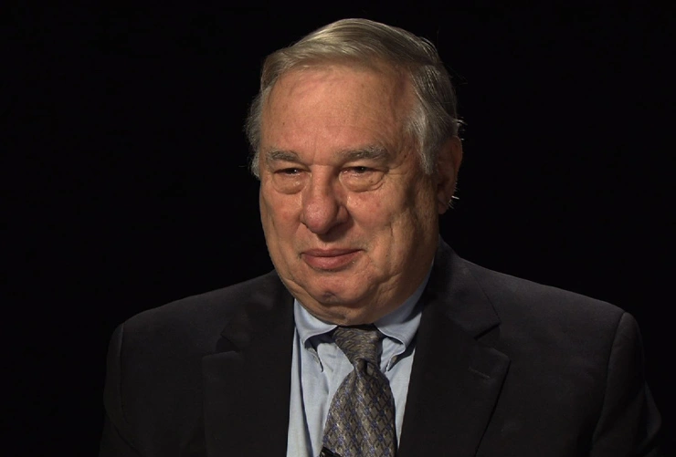 Gerald Wilson seated in front of a black background for an on camera interview.