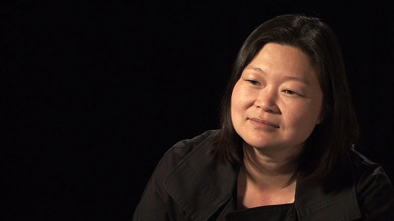 J. Meejin Yoon seated in front of a black background for an on camera interview.