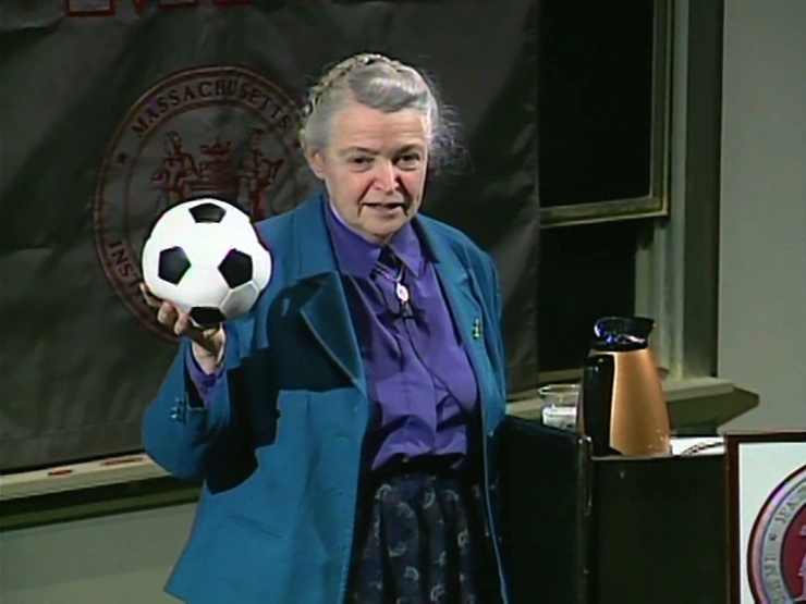 Mildred E. Dresselhaus uses a soccer ball as a prop to illustrate the structure of buckyballs.