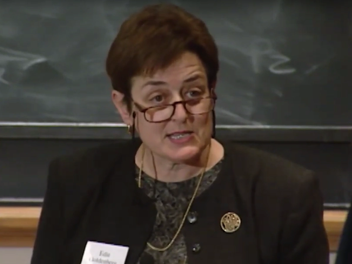 Maragaret Macvicar gives speech in front of chalkboard