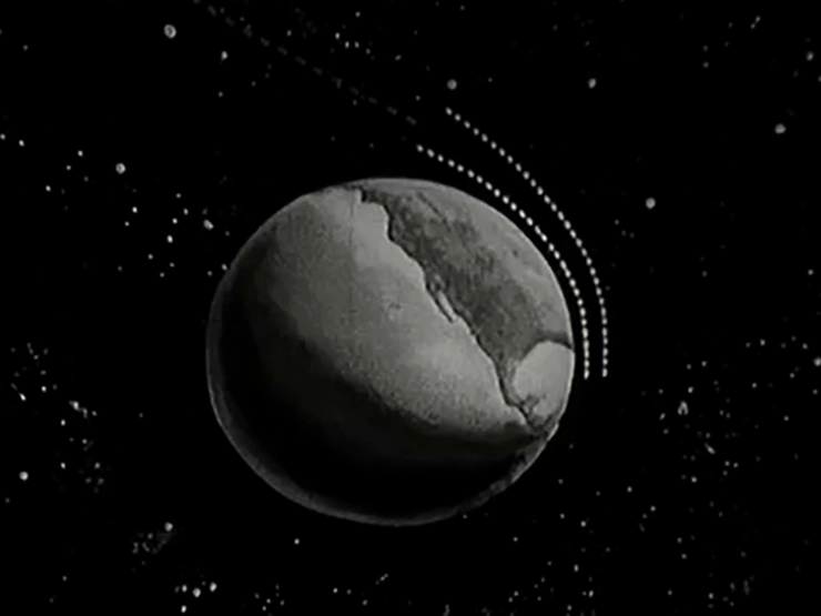 A model is used to explain possible challenges of the Apollo Command Module to Earth
