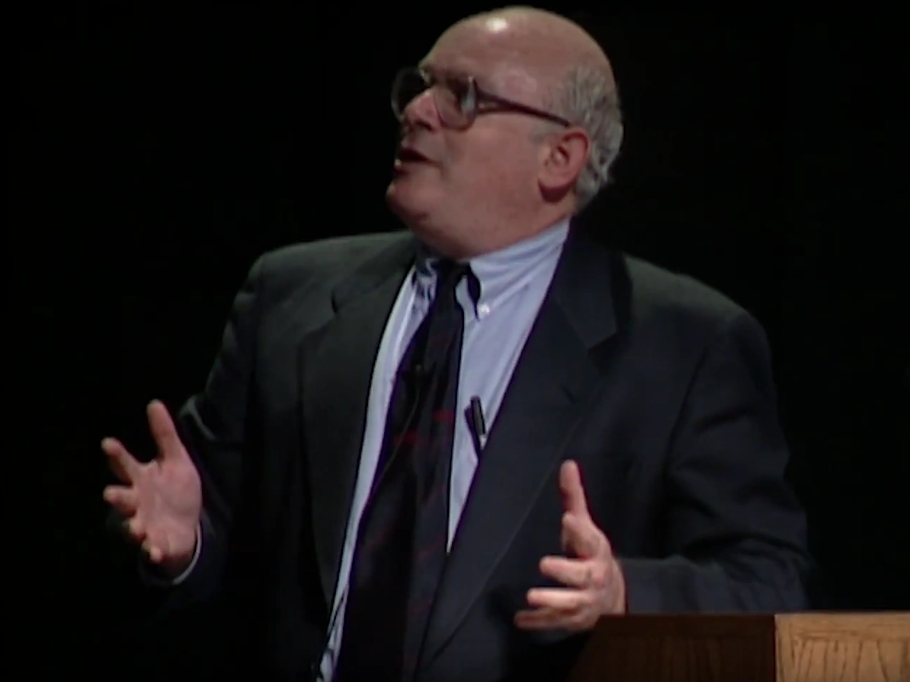 Michael Lesk speaking onstage, looking off to the side