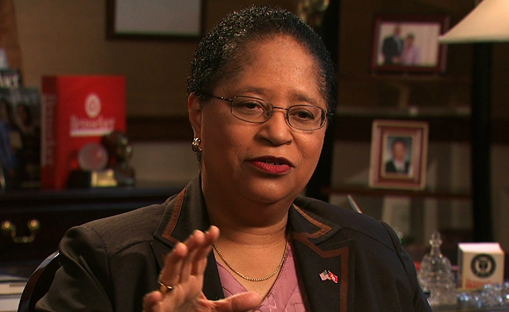 Shirley A. Jackson speaking mid-sentence, seated in office